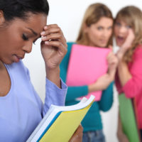 Sad student excluded by friends Sad student excluded by friends