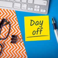 Day Off memo on office workplace. Holiday Announcement