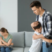 Man calming his son Man calming his son